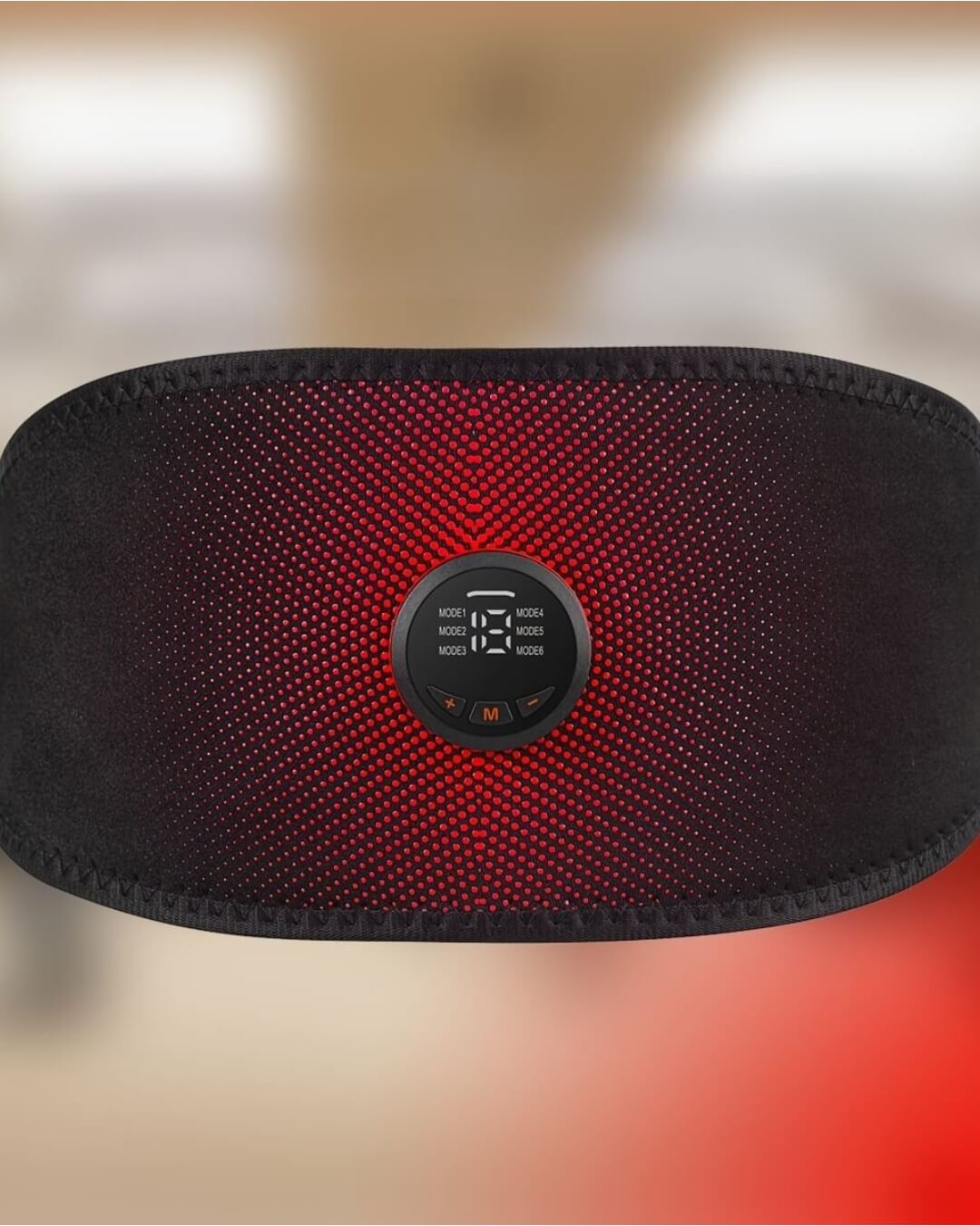 Black belly fat burner belt with red lighting on a blurred background