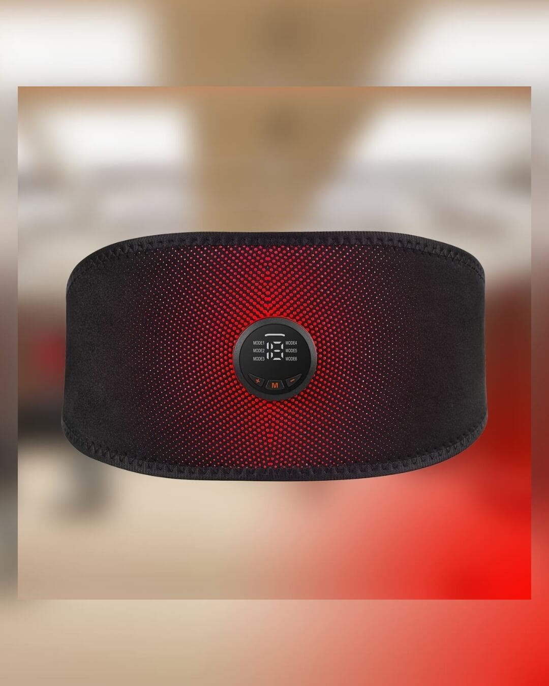 Black belly fat burner belt with digital display on a blurred background