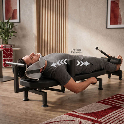 Person using a Full Body Stretching Machine with Cervical Traction & Spinal Decompression in a living room setting