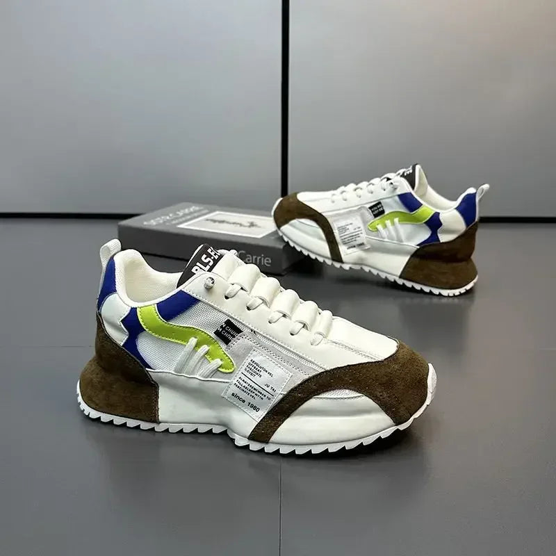White summer sneakers with brown and green accents on a reflective surface