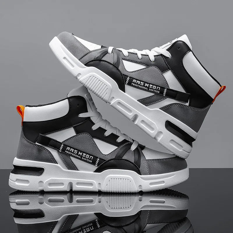 Gray and black sneakers with white soles on a reflective surface and gray background