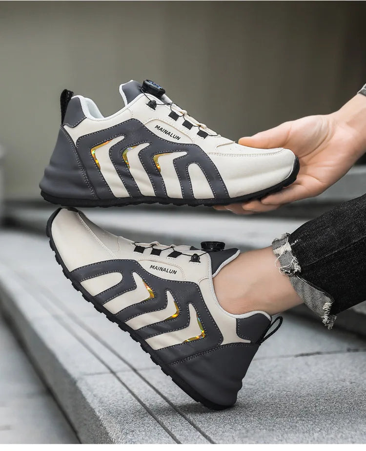 Person wearing black and white sneakers with a gray background