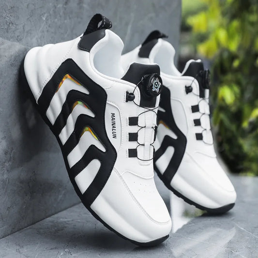 White sneakers with black and orange accents on a gray surface