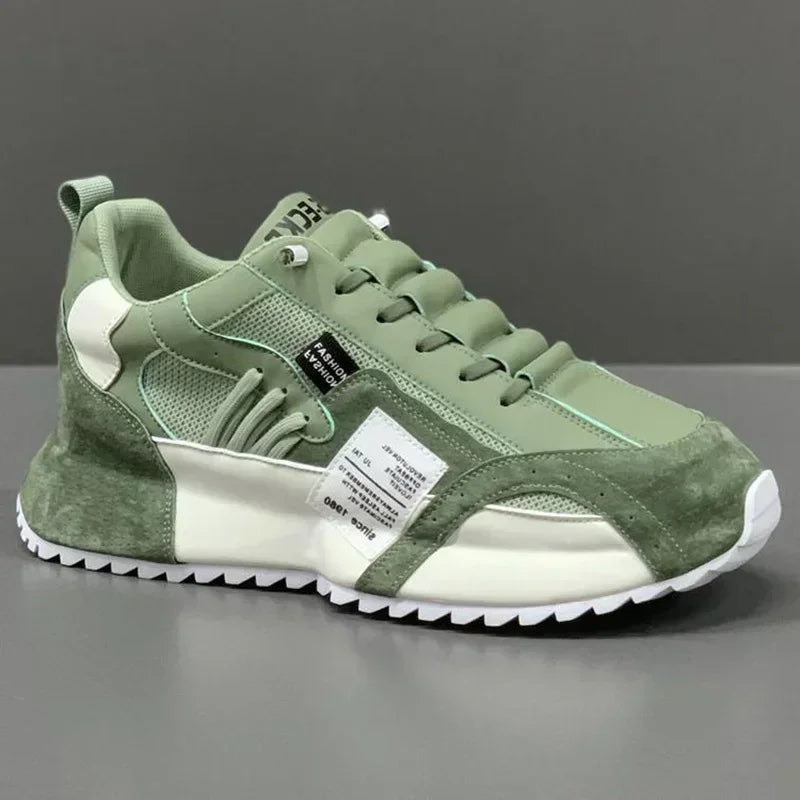 Green summer sneaker with a white label on a gray background