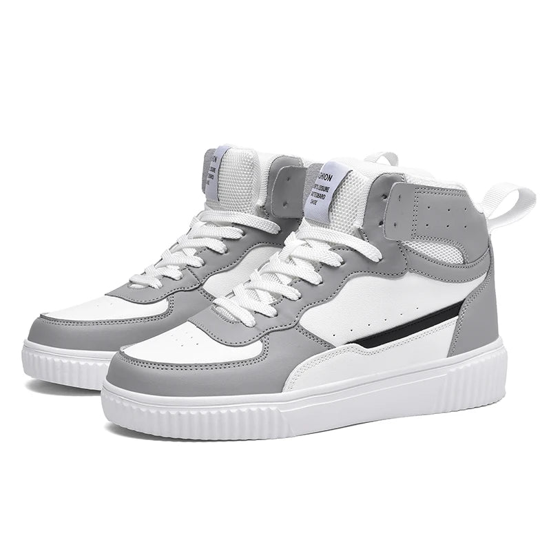 Gray and white sneakers with black accents on a white background