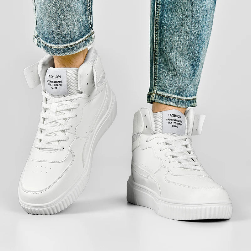 White high-top sneakers worn with light blue jeans on a gray background