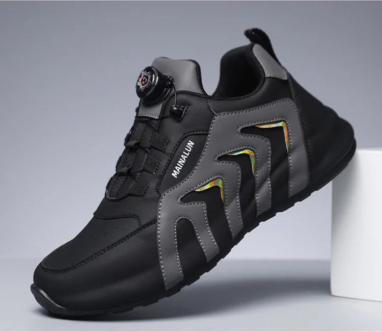Black and gray sneaker on a white stand with a gray background