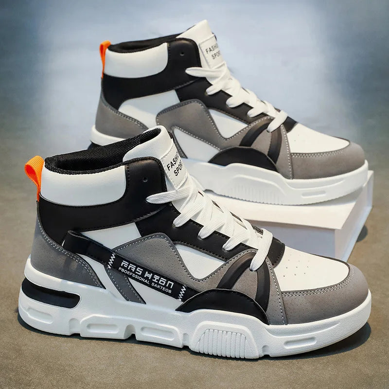 Pair of high-top sneakers with black, white, and gray design on a reflective surface.