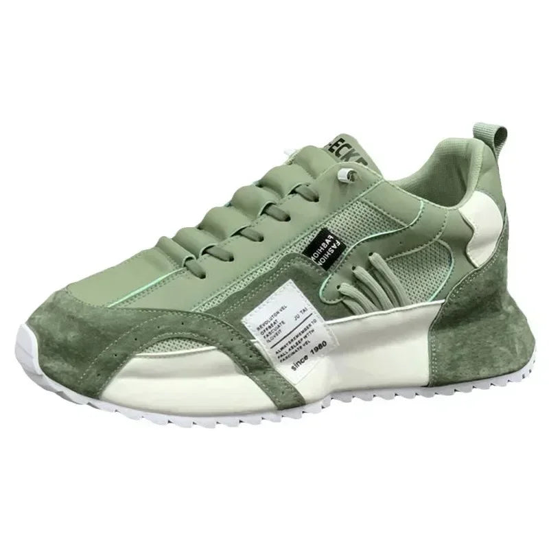 Green and white summer sneaker with a visible brand label on a white background