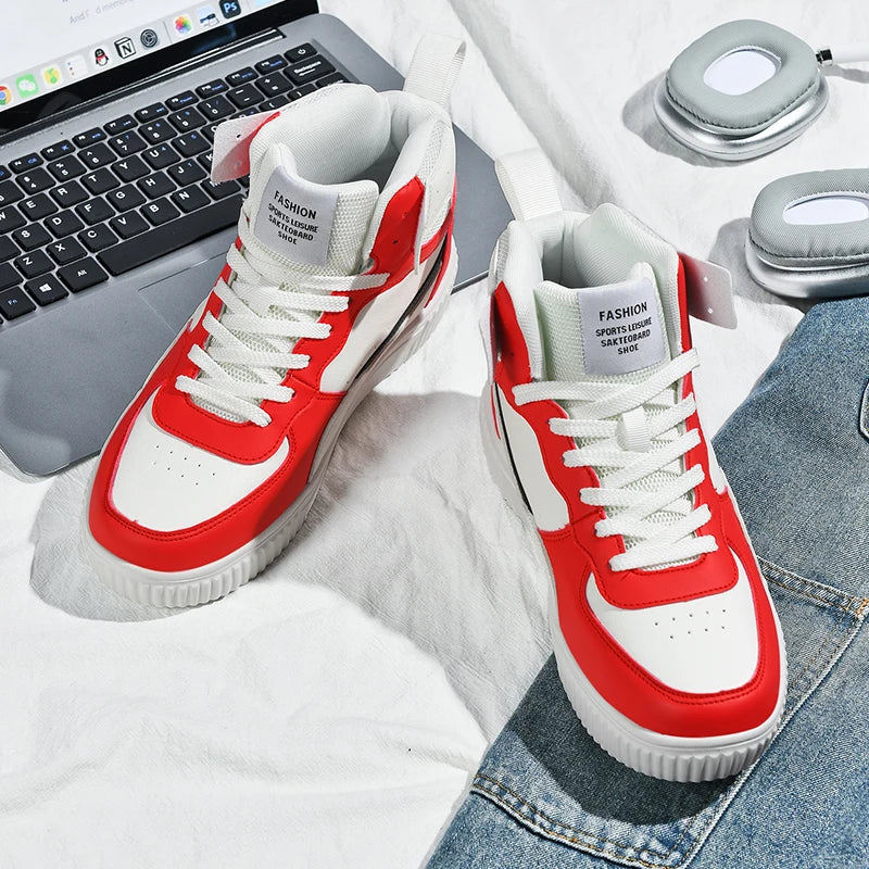 Red and white sneakers on a surface with a laptop and jeans in the background