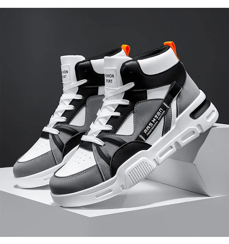 Gray and white high-top sneakers with black accents on a dark background