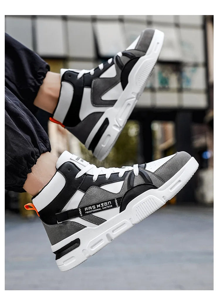 Black and gray sneakers with white soles being worn indoors.