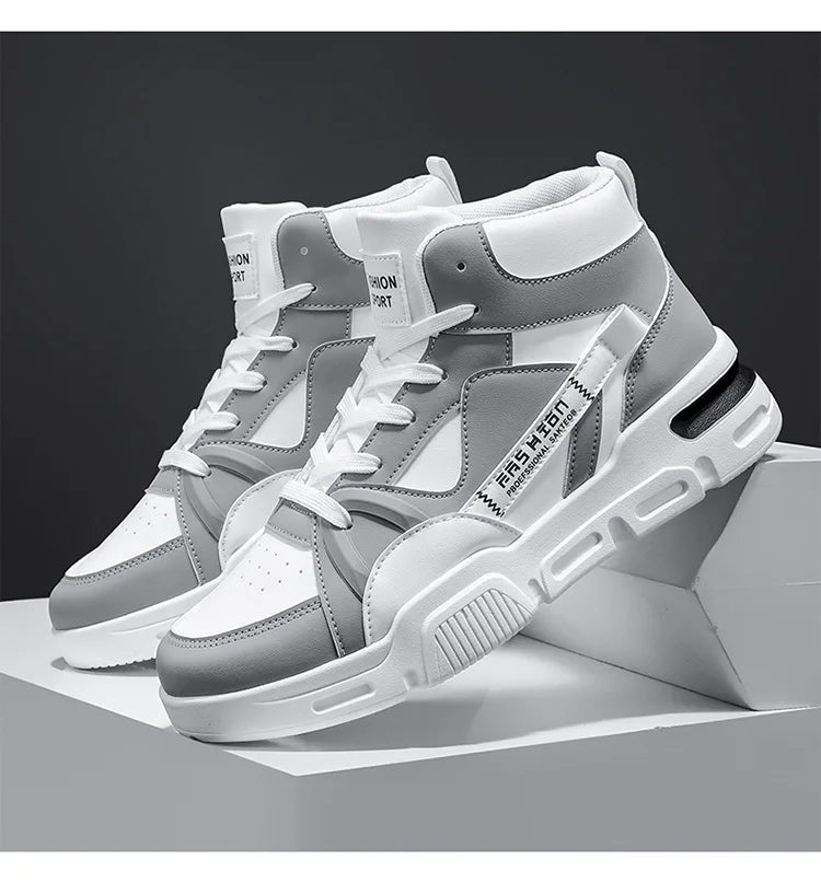 Gray and white high-top sneakers on a dark background