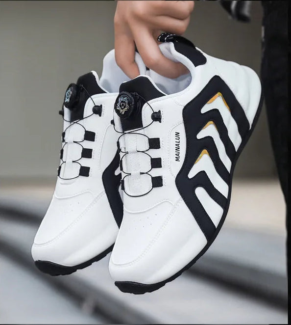 White and black sneakers on a gray surface.