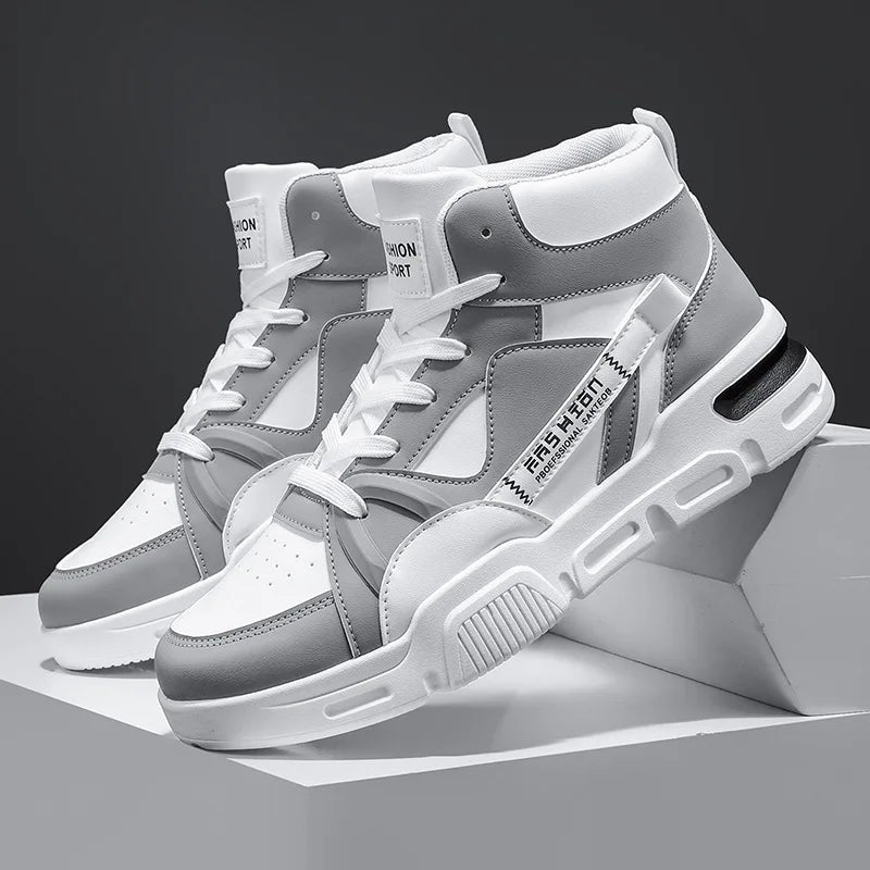 Gray and white high-top sneakers on a gray background
