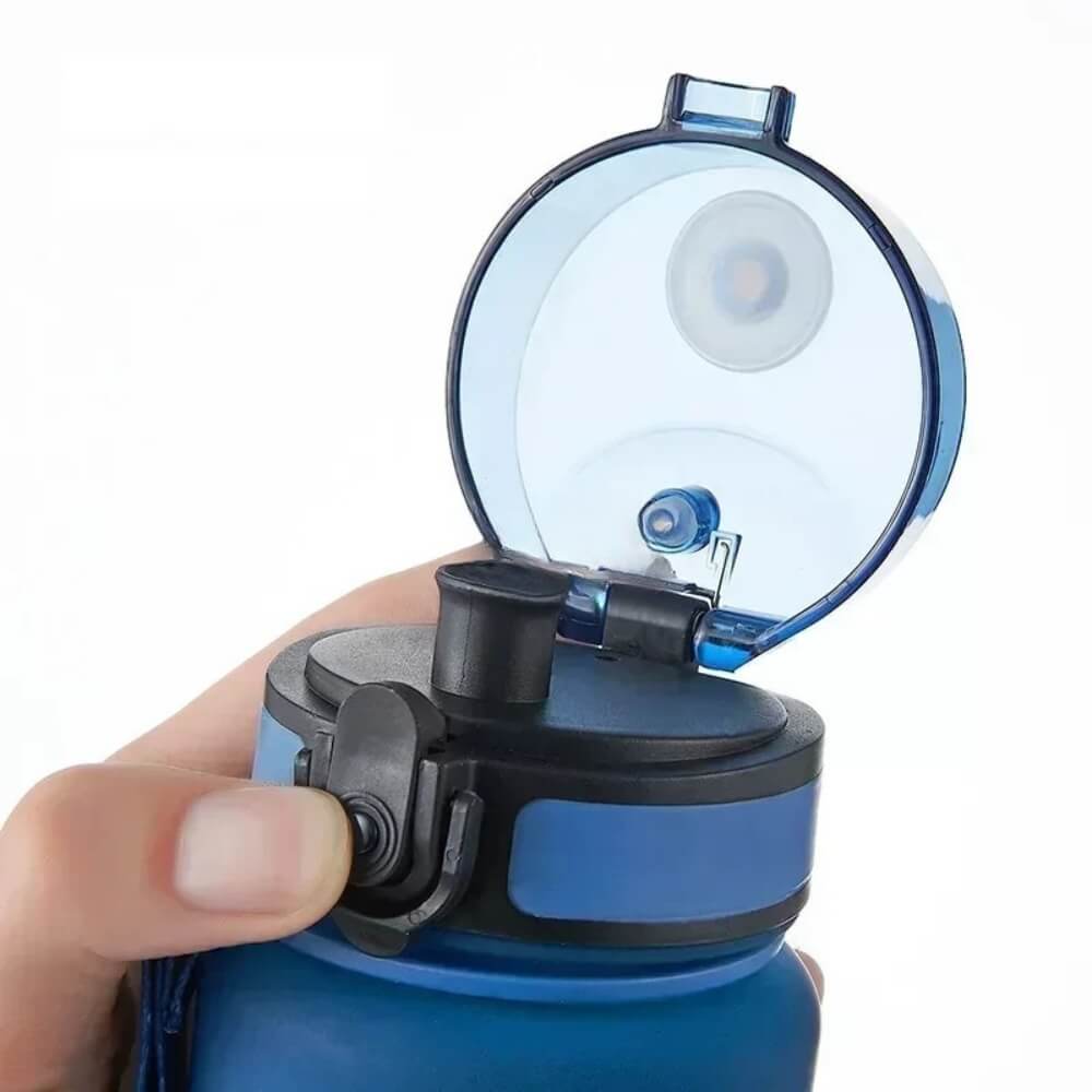 A blue sport water bottle with the lead open.