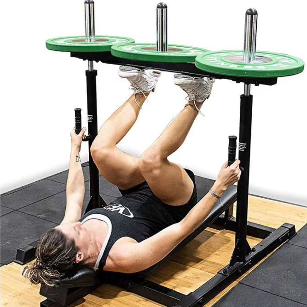A woman working out with a vertical leg press machine sold by 100 Spartans