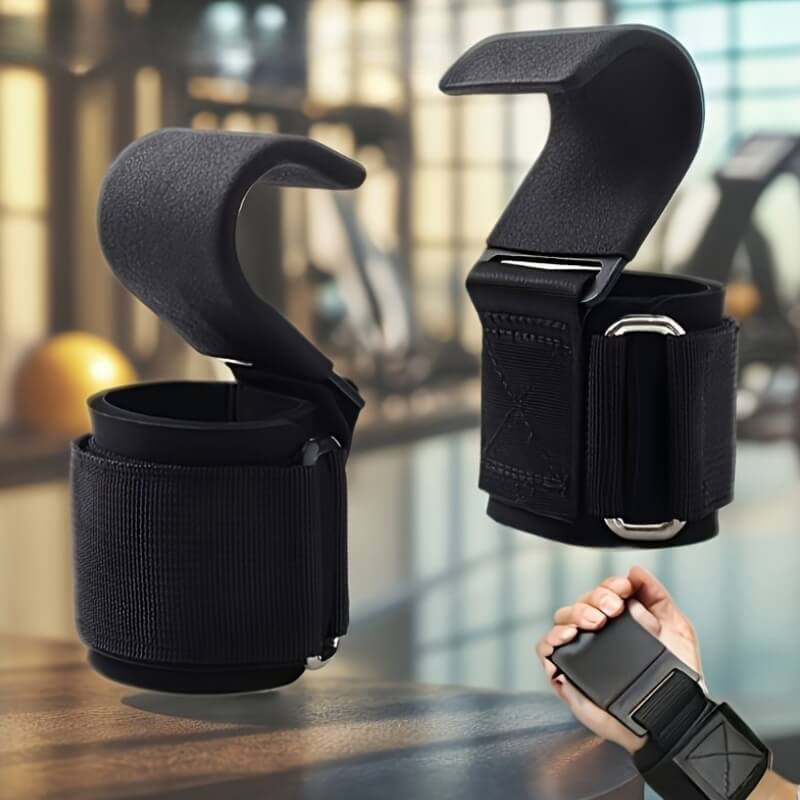 Black weight lifting hooks with a blurred indoor background