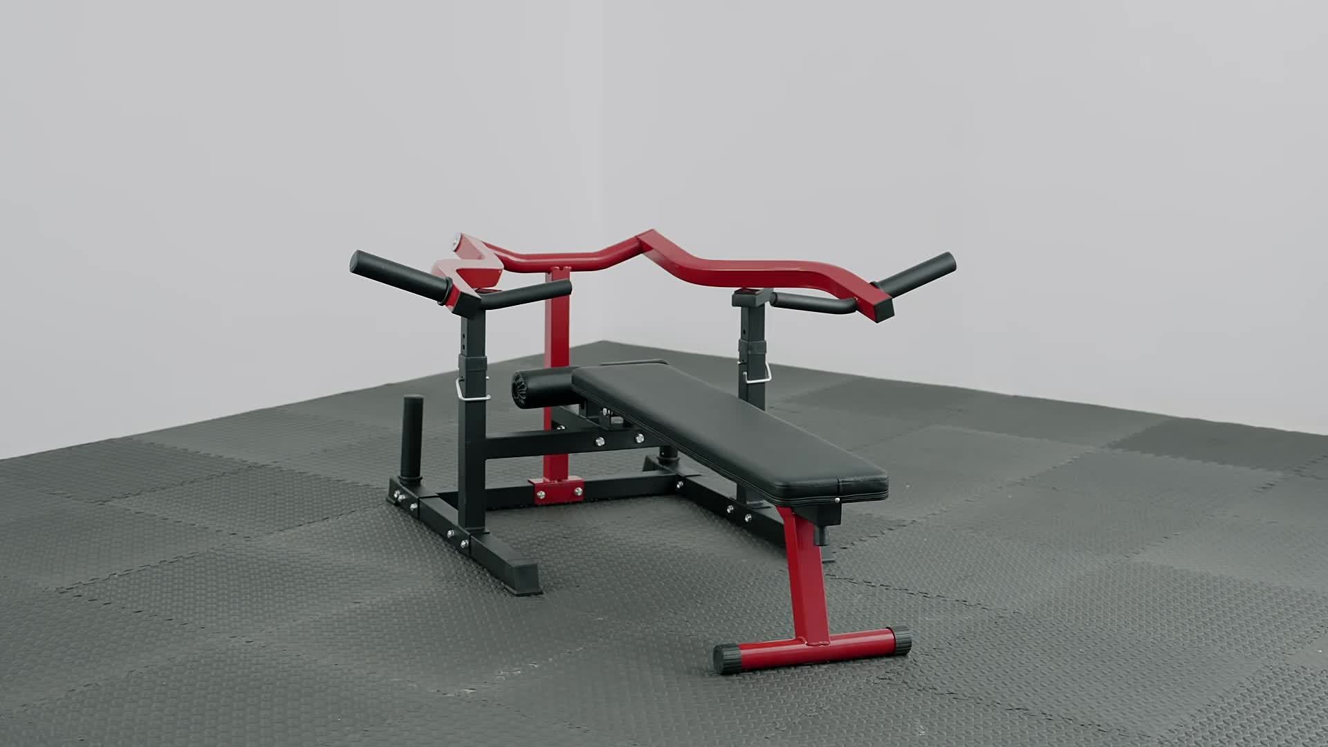 Chest press machine with red and black frame on a gray floor