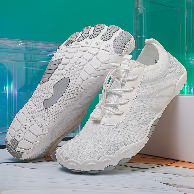 White deadlift shoes with gray soles on a light wooden floor.