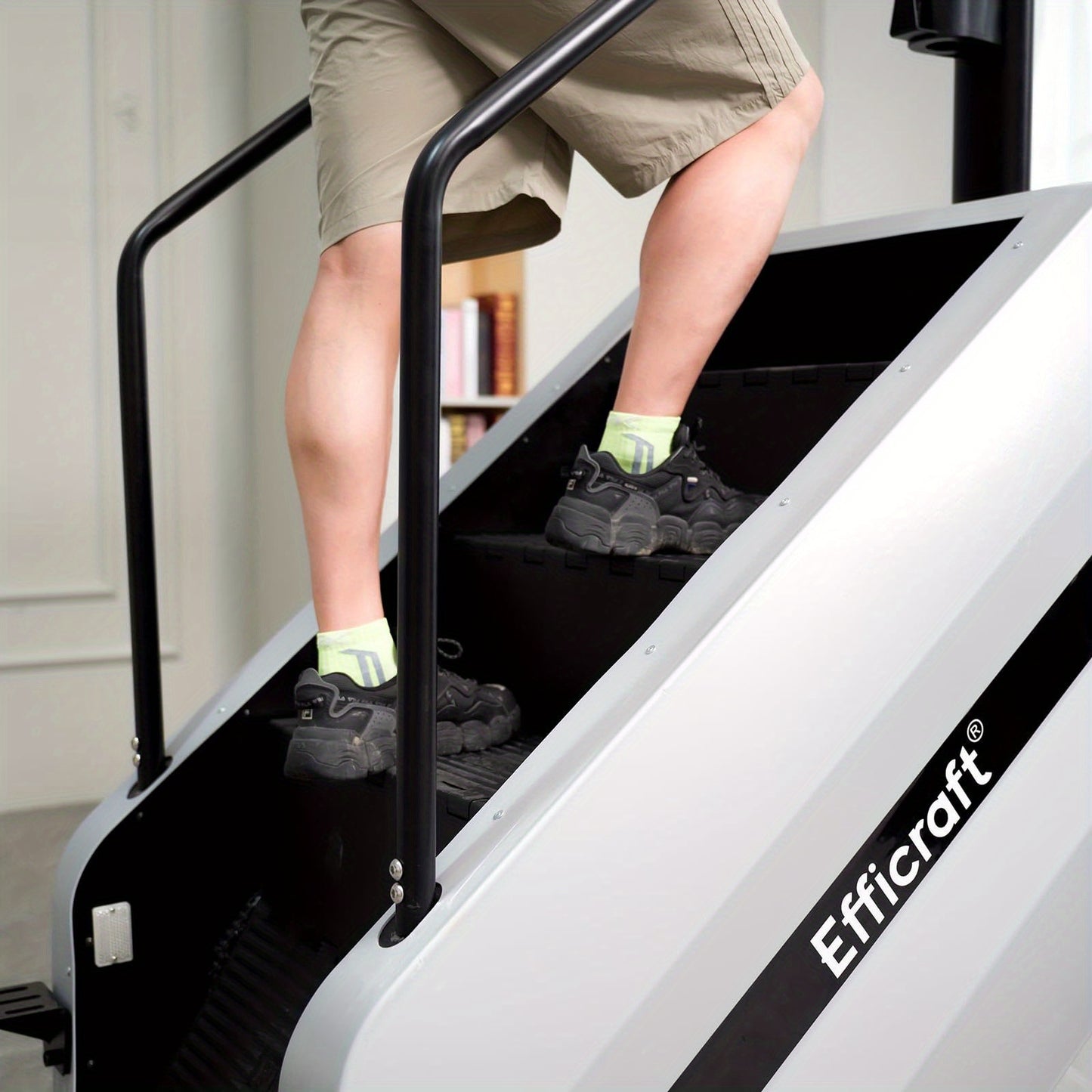 Person using a stair climber machine sold by 100 Spartans