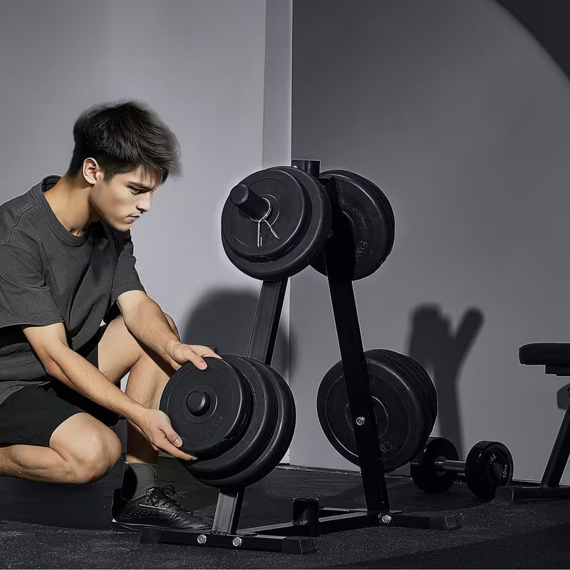 Person adjusting weights on a calibrated plate weight tree in a gym setting
