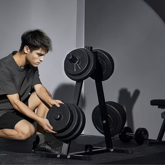 Person adjusting weights on a calibrated plate weight tree in a gym setting