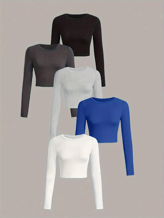 Set of five long-sleeve crop tops in black, gray, white, and blue on a beige background