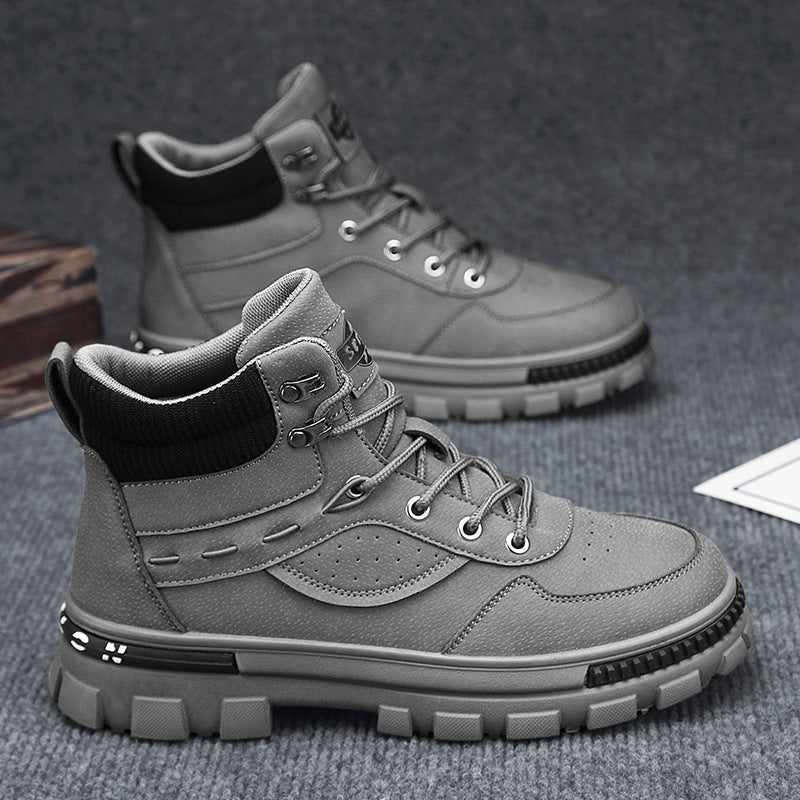 A grey Martin high top boots