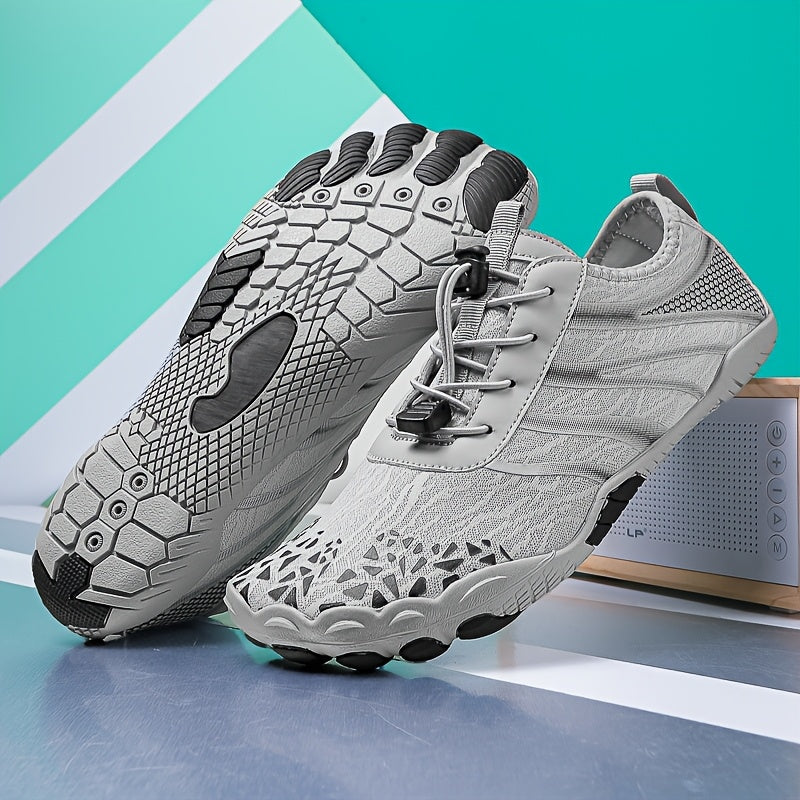 Gray deadlift shoes with black soles on a blue and green striped background