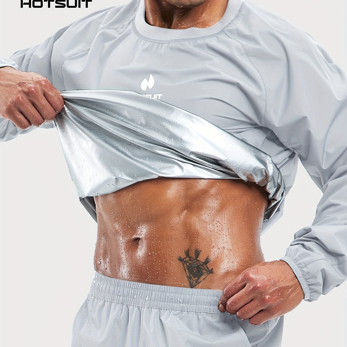 Person wearing a light gray sauna sweat suit top with 'HOTSUIT' branding, showing a tattoo on the abdomen.