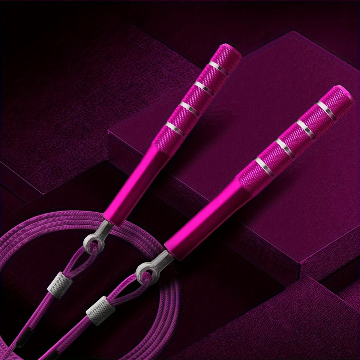 Pink adjustable skipping rope on a purple background