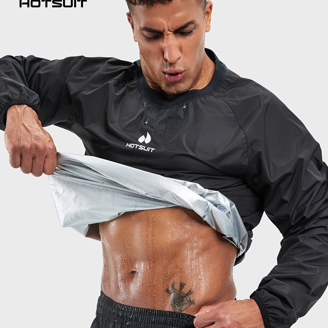 A man wearing a black 'Hotsuit' sauna sweat suit top with a white background