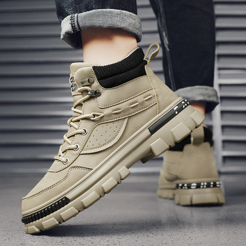 A person wearing a pair of Khaki Martinhigh top boots