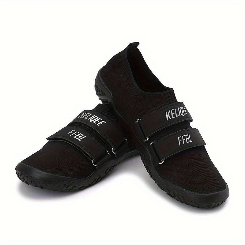 Black shoes for lifting weights with velcro straps on a white background