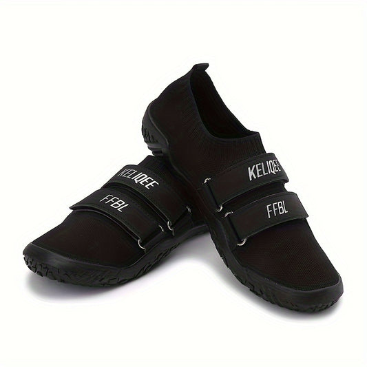 Black shoes for lifting weights with velcro straps on a white background