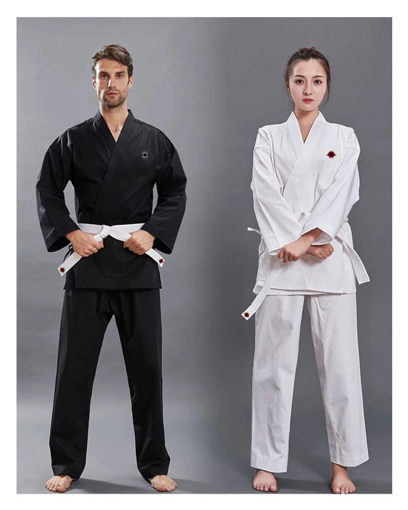 A man wearing a white 14oz Heavyweight Karate Gi and a woman wearing a black 14oz heavyweight karate gi sold by 100 Spartans