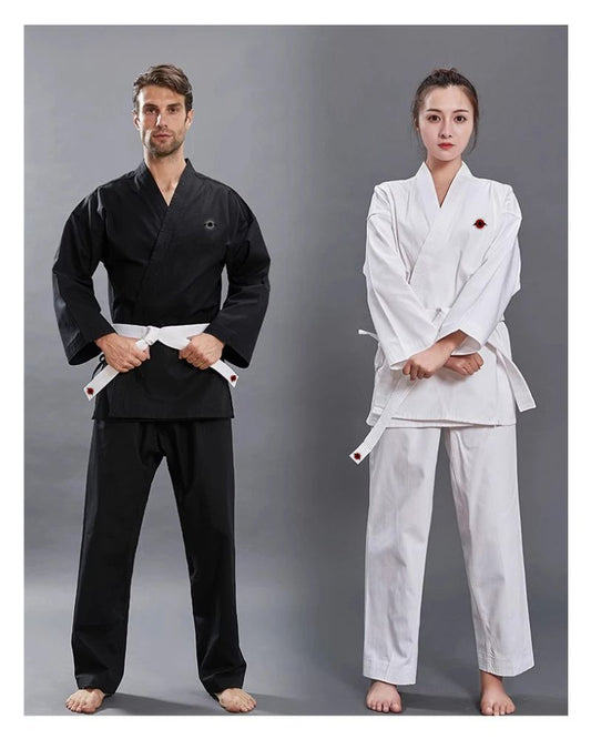 A man wearing a white 14oz Heavyweight Karate Gi and a woman wearing a black 14oz heavyweight karate gi sold by 100 Spartans