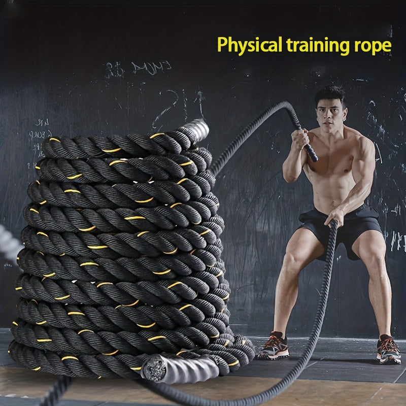 Man working out with an exercise battle rope on a dark background