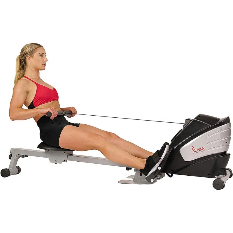 A woman working out with a sunny magnetic rowing machine sold by 100 Spartans