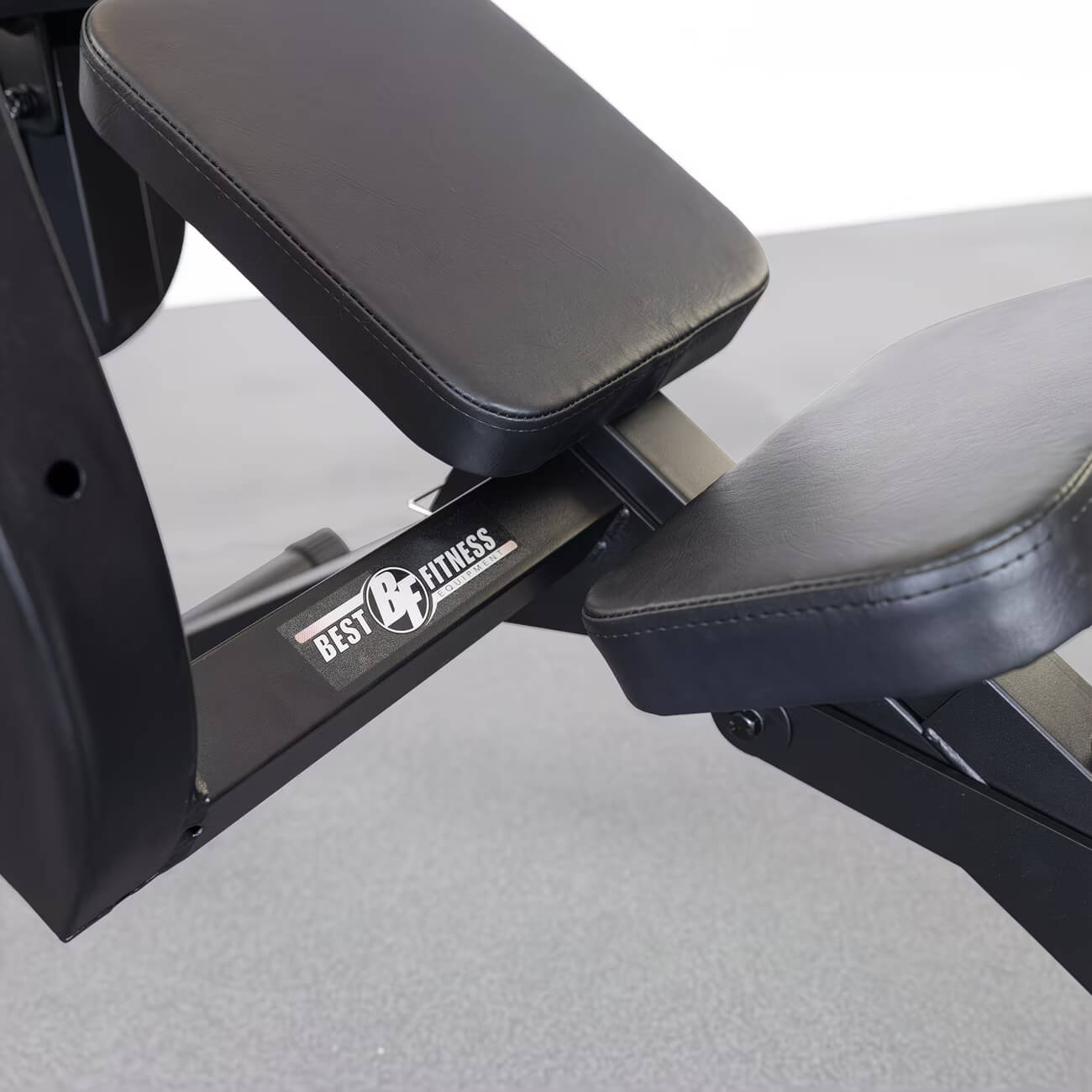 A black semi-recumbent ab bench