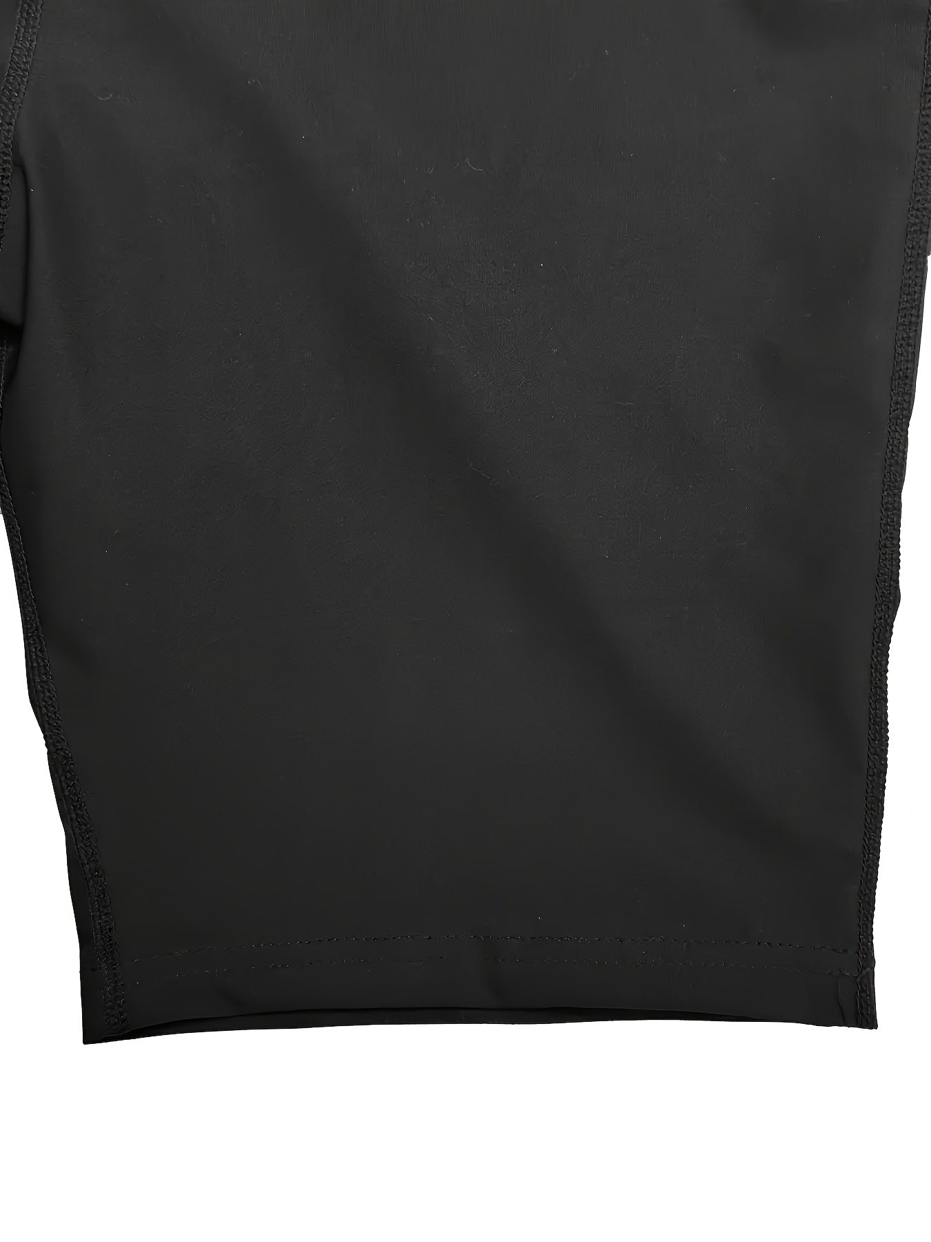 Close-up of a black fabric texture on a white background