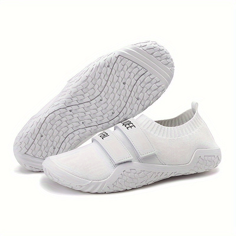 White shoes for lifting weights with a textured sole on a white background