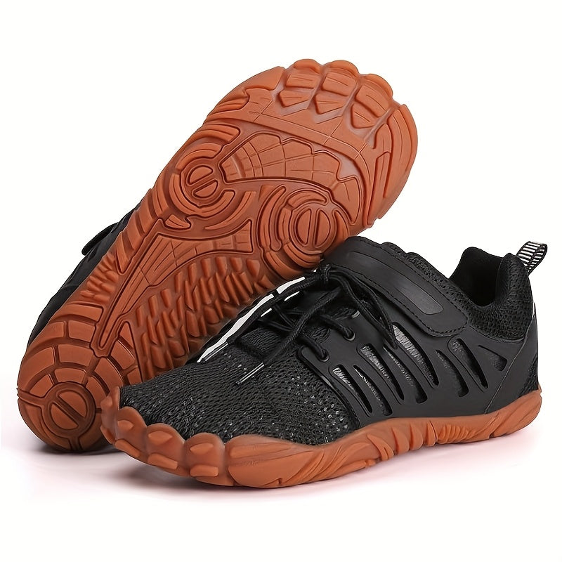 Black barefoot hiking shoes with brown soles on a white background