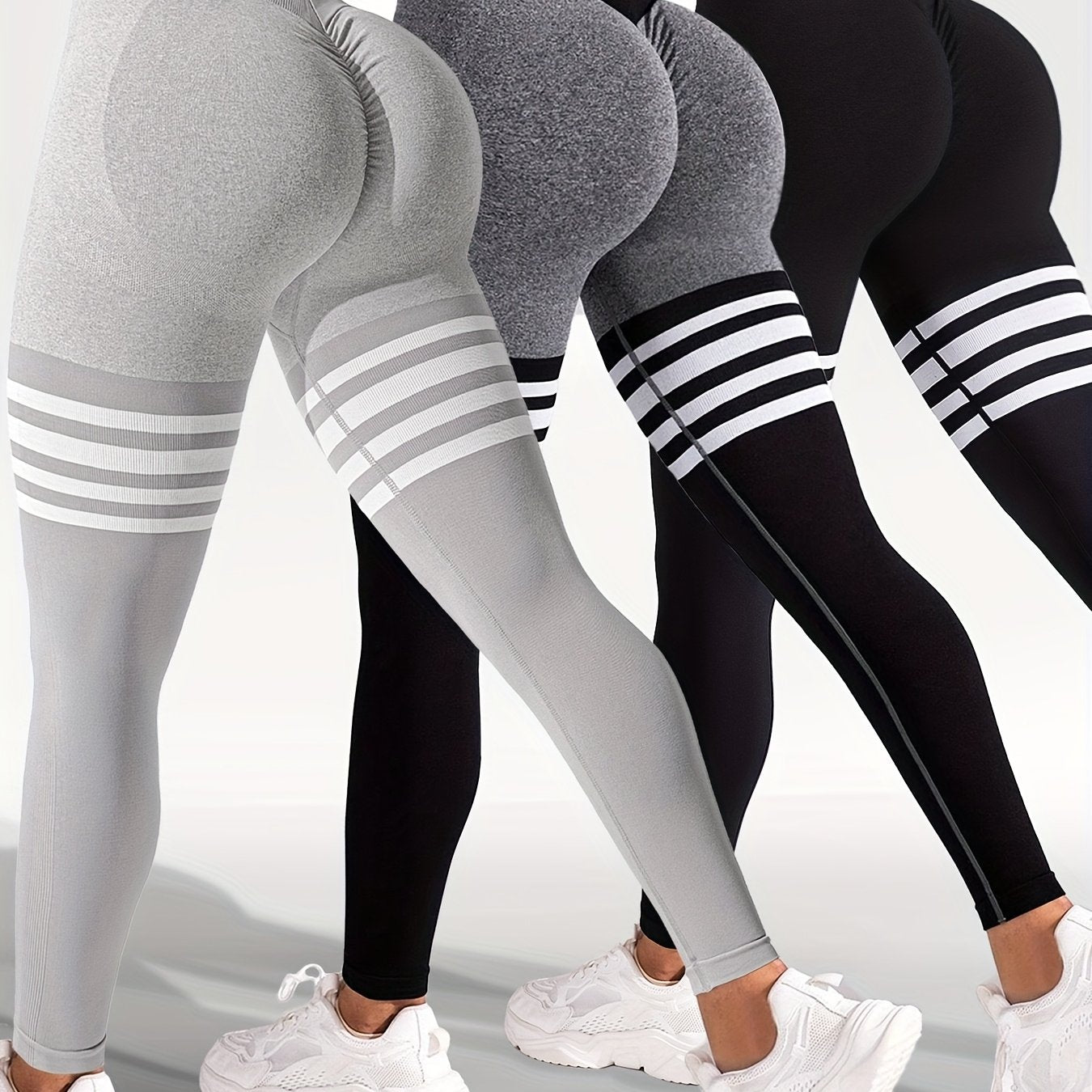 The back view of 3 women wearing a pale grey, dark grey and black yoga leggings sold by 100 Spartans