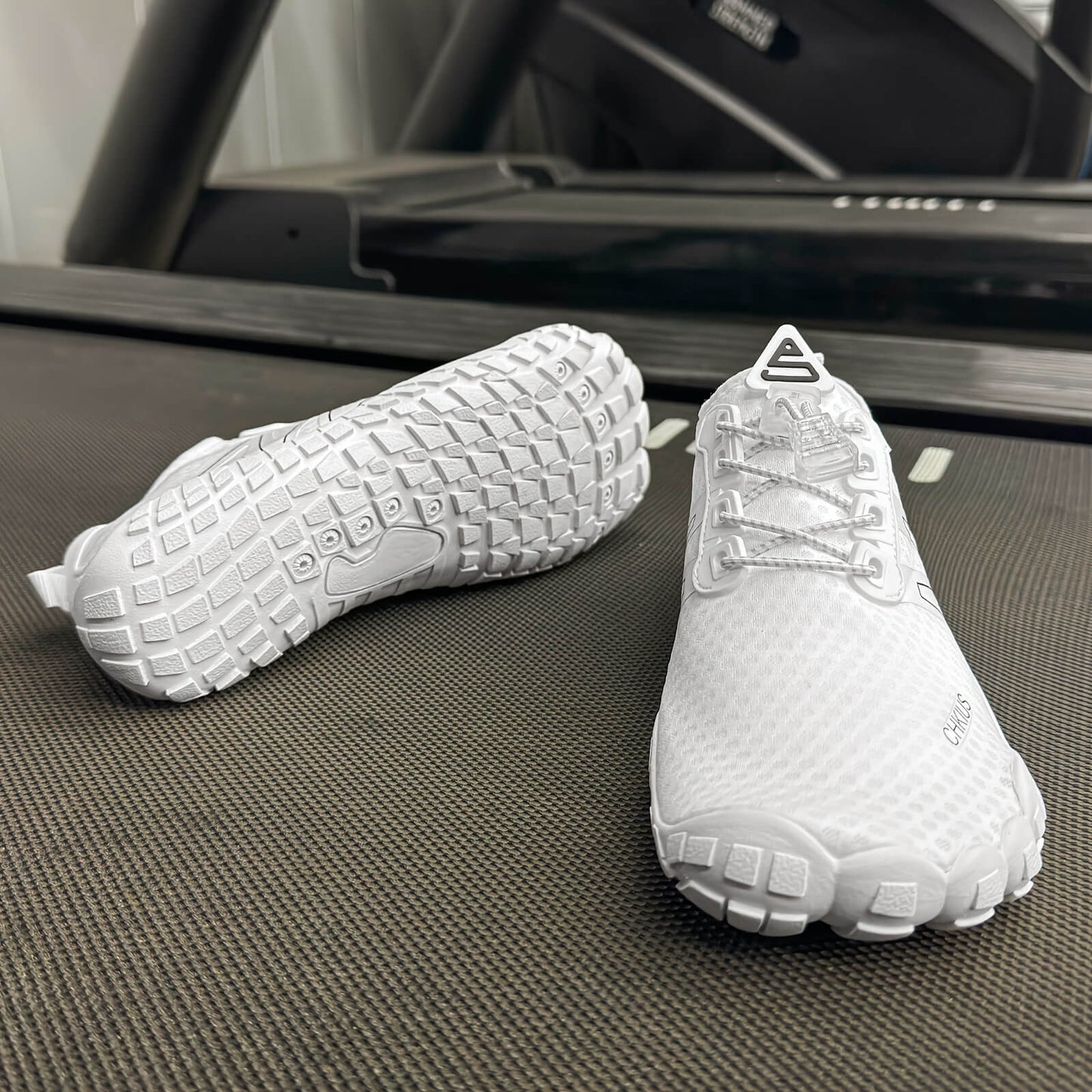 White deadlift shoes on a treadmill