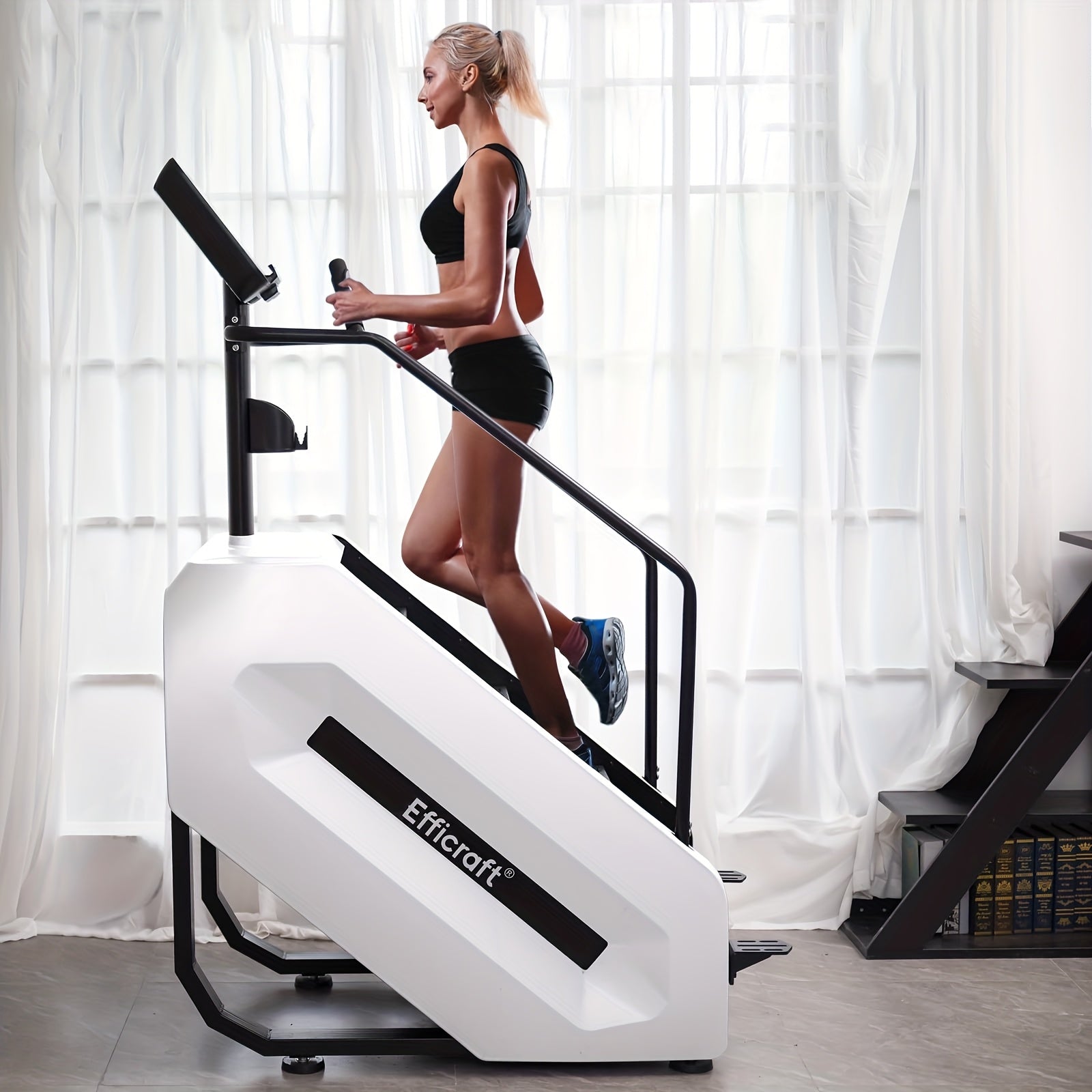 Woman using a stair limber machine in a home setting with white curtains.