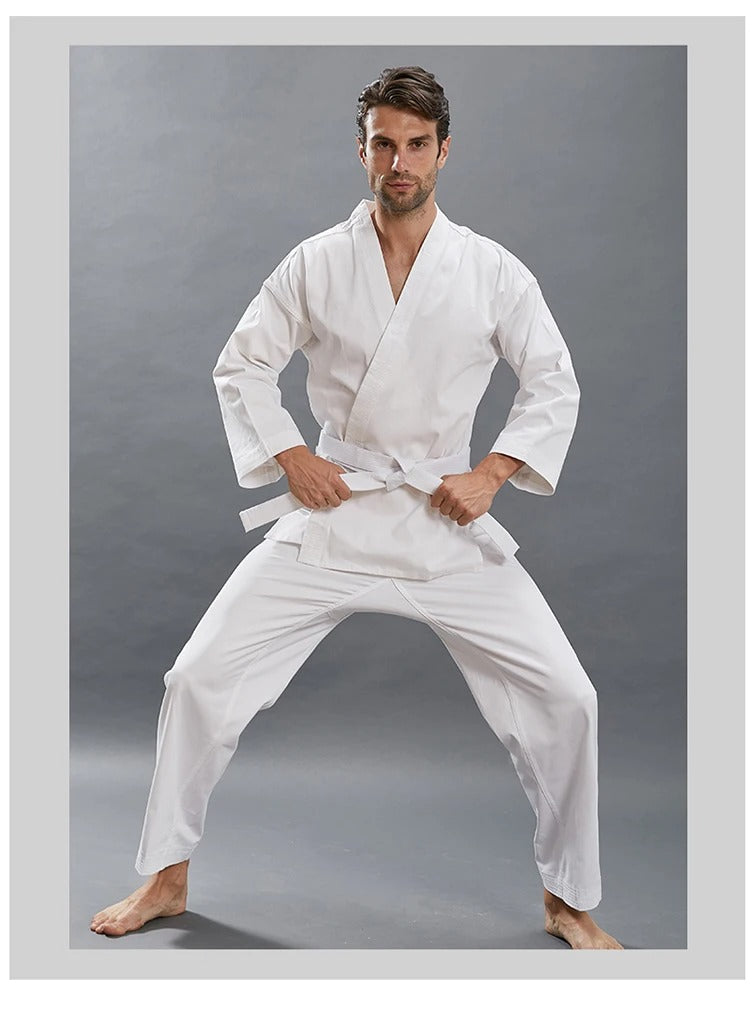 A man wearing a white 14oz Heavyweight Karate Gi sold by 100 Spartans