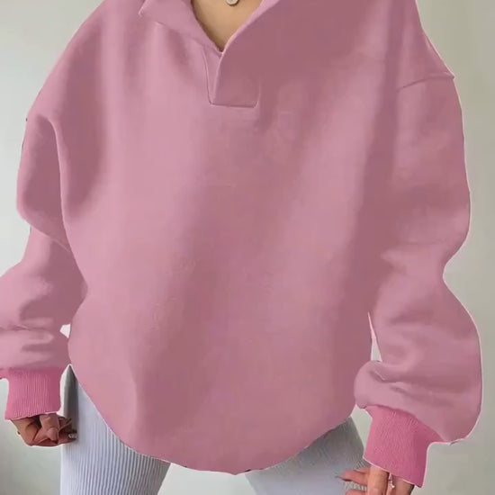 The front view of a woman wearing a camouflage winter hoodie for women sold by 100 Spartans