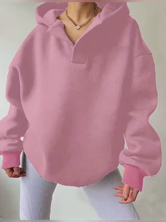 The front view of a woman wearing a camouflage winter hoodie for women sold by 100 Spartans